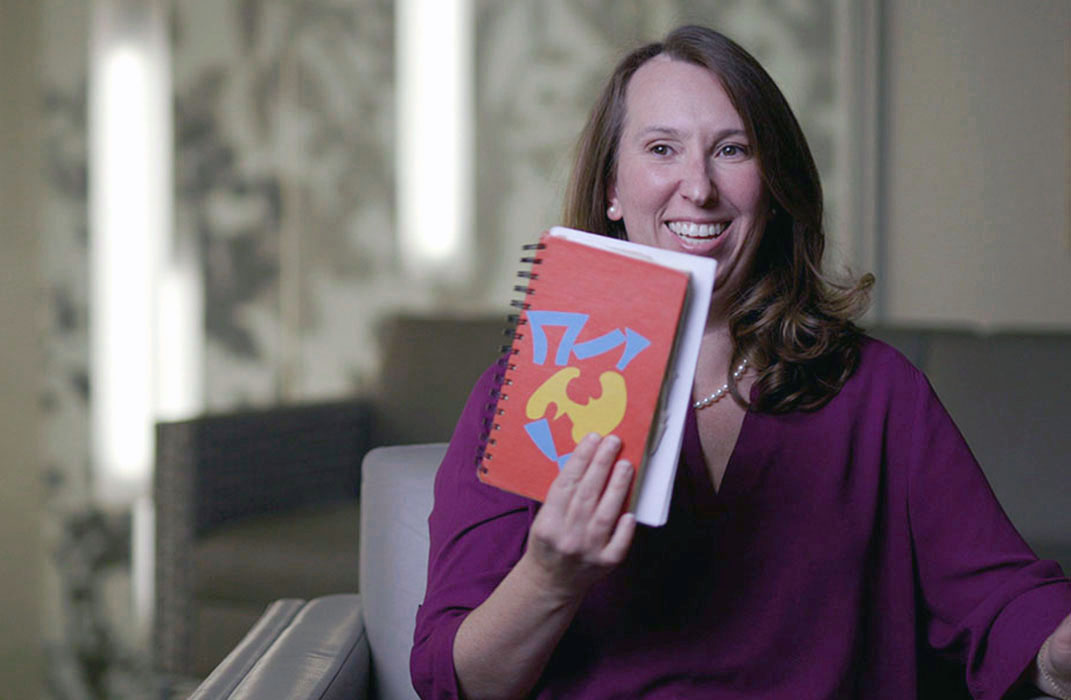 Lindsay Strauss holding the notebook she brought with her to all of her appointments